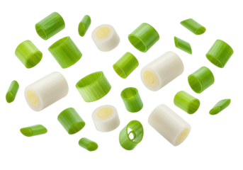 Dynamic shot of vibrant green and white chopped scallion pieces scattered in mid-air, macro close-up against a transparent studio background. Concept of fresh culinary ingredients