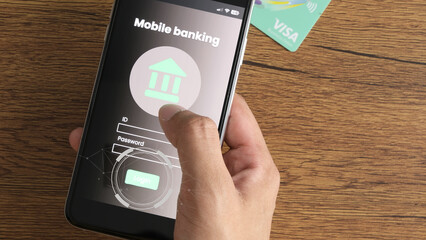 Mobile banking, online transactions, and financial security concept with person logging into banking app on smartphone, showing secure login screen and credit card on wooden table