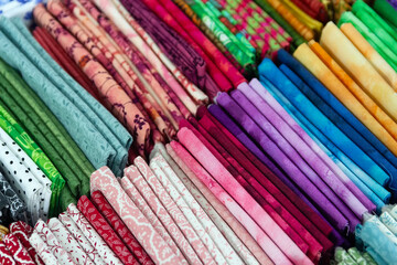 Multicolored textiles on the counter of the store