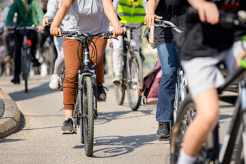 Group of cyclists on city road, street, asphalt