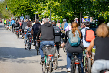 Group of cyclists on city road, street, asphalt