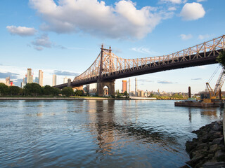 Queensboro Bridge and Midtown Manhattan Skyline - The Queensboro Bridge over the East River with the Midtown Manhattan skyline at sunset, New York City.
