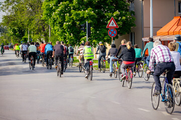 Group of cyclists on city road, street, asphalt