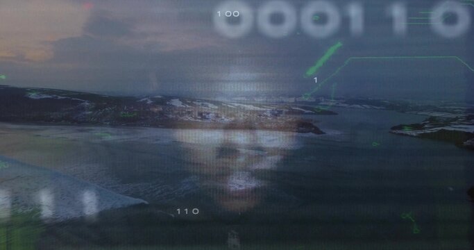 Floating projected male face hovering over arctic coast, with binary code and green HUD graphics