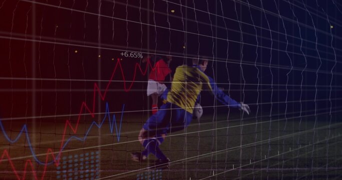 Diving goalkeeper in yellow gear on night pitch, with ball, net under digital graphs, copy space - Powered by Adobe