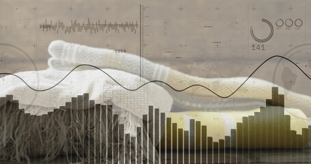 Displaying folded knit blankets with cable pattern resting on wooden tabletop, data charts overlay