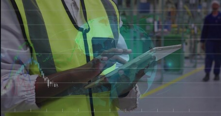 Monitoring warehouse worker wearing safety vest holding tablet and stylus viewing digital overlays