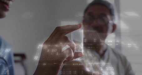 Showing doctor in blue scrubs operating floating interface in clinic, with stethoscope, data points