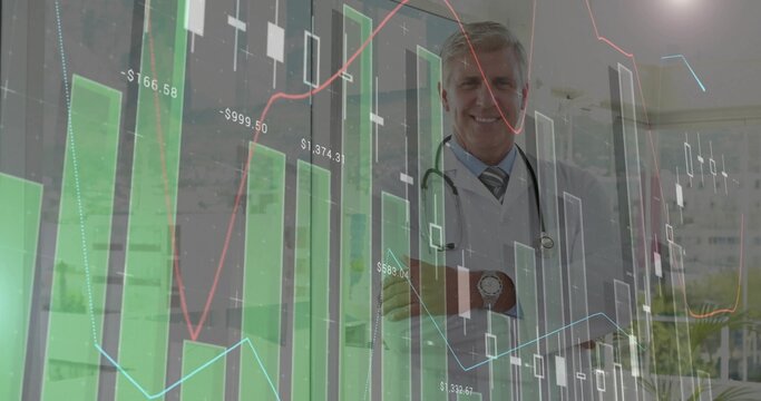 Standing senior male doctor crossing arms at clinic with stethoscope, financial data, copy space