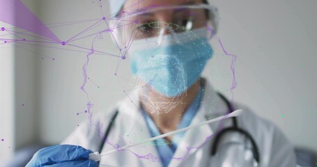 Holding sterile swab, doctor wearing nitrile gloves in testing room, with holographic head network