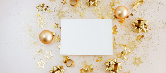 Christmas card blank mockup with copy space, xmas gold decor top view flatlay on beige background. Banner. Greeting card.Christmas, New Year background.