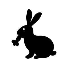 Obraz premium Silhouette of a rabbit with long ears and something in its mouth