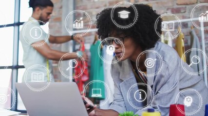 Fashion designer comparing device data upon making call with data icons floating - Powered by Adobe