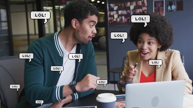 Office colleagues leaning examining laptop screen spotting funny designs reacting and high-fiving