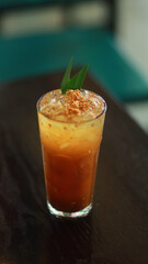 Coconut ice cream with pandan leaf garnish