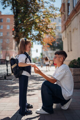 Kids exchanging gifts on a sunny street during a school day
