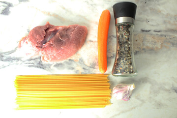 Products for cooking pasta on table top view
