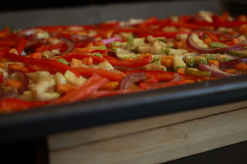 roasted zucchini, carrots, and red bell peppers on a baking tray