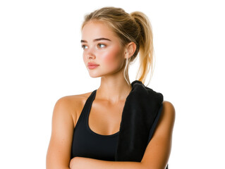 Fototapeta premium Portrait of a blonde woman in a black sports bra with a towel over her shoulder looking to the side
