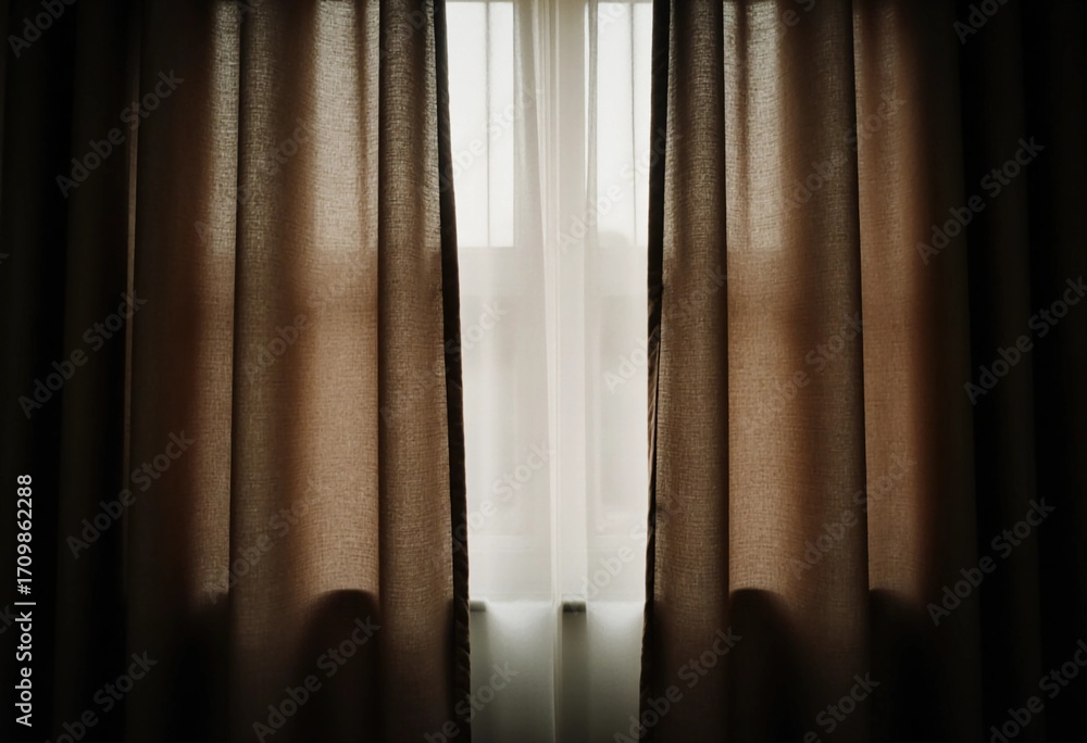 Poster brown curtains softly filter light, creating a warm atmosphere in the room. their texture adds depth