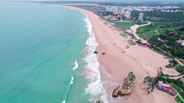 Landscape footage at Tr&ecirc;s Irm&atilde;os beach in Alvor, taken in winter time.
