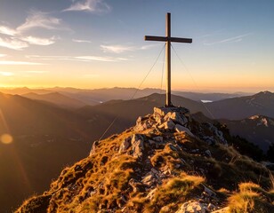 Wooden cross atop mountain peak at sunrise (1)