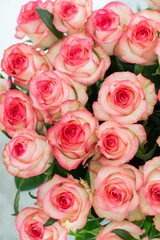 Elegant bouquet of pink and cream roses close up. Romantic floral background perfect for weddings, Valentine’s Day, anniversaries