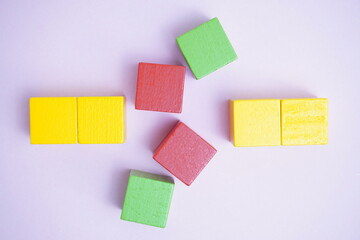 colored wooden blocks displayed on a soft-hued background, representing creativity, learning, and playful exploration