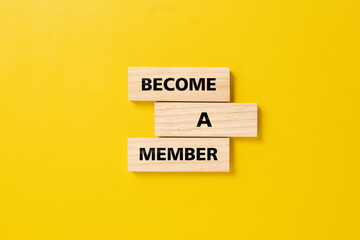 The announcement message become a member on wooden blocks. membership and subscription