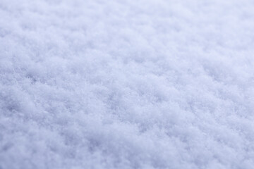 Close-up of fluffy white snow, displaying intricate frosty texture for serene winter season backdrops, holiday design projects, and cold weather visuals
