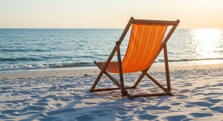 Orange Beach Chair at Sunset on Sandy Shore