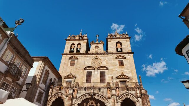 Braga Cathedral exteriors display Romanesque portals gothic pinnacles and weathered granite walls anchoring the old town in Braga, Portugal