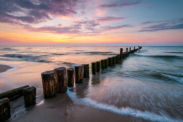 Serene Baltic Sea Beachscape at Sunset with Wooden Groynes and Dramatic Sky