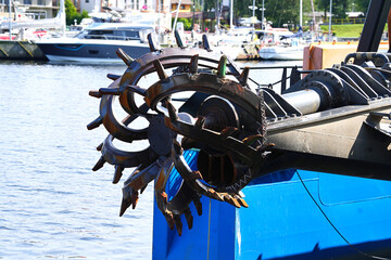 A close-up of a dredger cutter used to loosen the soil at the bottom of a reservoir