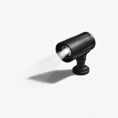 Small, black spotlight emitting a bright beam