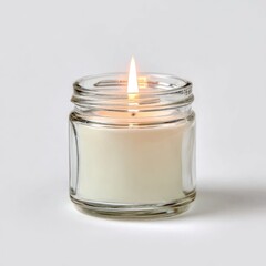 Small, clear glass jar candle with lit wick (1)