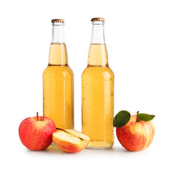 Delicious cider in glass bottles and apples isolated on white