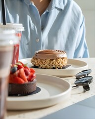 Fresh Berry Chocolate Tart with Iced Coffee and Smoothie in Modern Cafe