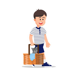 Cute boy walking with a picnic basket carrying his pet cat