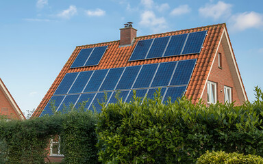 Fototapeta premium Modern brick house with solar panels installed on the roof for clean energy generation illustration