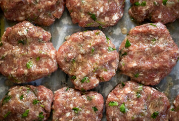 Raw Turkish organic meatballs in a row backgrounds