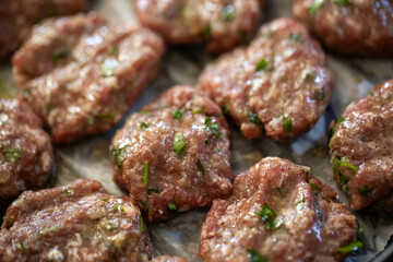 Raw Turkish organic meatballs in a row backgrounds