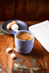 Pizza with ham, salami, cherry tomatoes and mozzarella cheese. Rustic wooden background. Soft focus. Close up.	