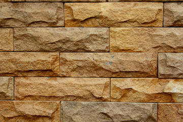 Weathered wood and old brown brick wall textures form a rough, abstract, and intricate pattern