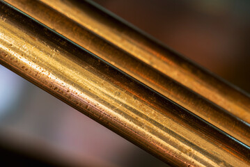 Copper rod with texture in close-up in an industrial space