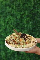 Assorted Fruits and Desserts on Elegant Plate