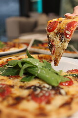 Closeup of Delicious Pizza Slice with Melted Cheese