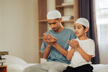 A Muslim father and son praying together indoors, symbolizing Islamic faith, cultural values, and family education, perfect for religious, academic, and community content.