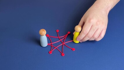 People in a circle are connected by lines and connections. Teamwork, digital connectivity, or interlinked systems. Networking, social interaction, corporate structures. Man puts team members in charge