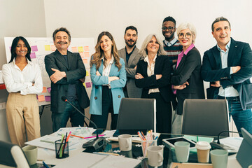 Confident diverse business team group portrait with arms crossed. Successful multi-generational...